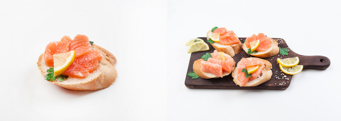Sandwich with red fish on a gray background. Sandwiches with trout on a wooden board. Sandwiches with salmon and lemon slices © Elena