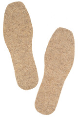 Felt insoles isolated on white background. Two warm insoles for shoes. Close-up