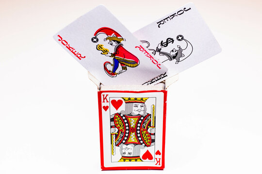 A deck of playing cards in a box and two jokers
