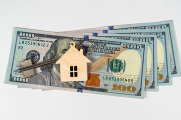 Money dollars and keys from the house, apartment. Buying, selling and renting real estate.