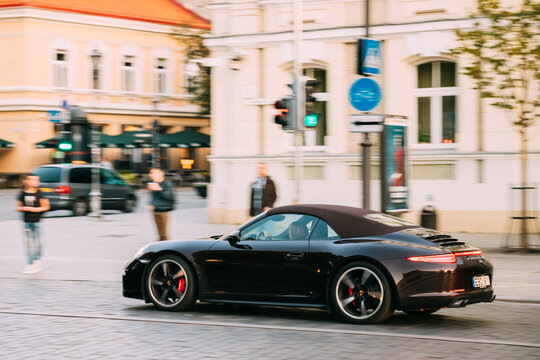 Vilnius, Lithuania - September 29, 2017: Side View Of Black Porsche 991 Targa 4S Car Moving On Street. Car Of Second Generation
