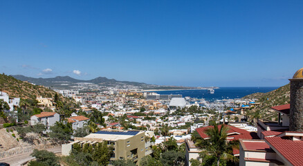 Fototapeta na wymiar panorama overview of the city of Cabo San Lucas with harbor in the background