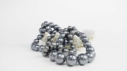 Black pearl necklace in oyster. Black pearls in a shell.Banner with a white background. Nacre. Thai pearl.