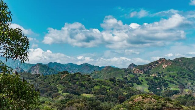 time lapse view of rolling clouds over the green Santa Monica Mountain range off Mulholland Rd in Calabasas California