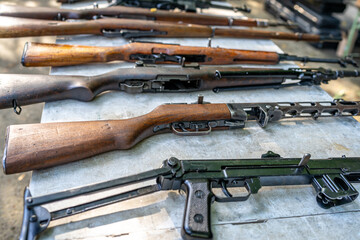 collection of historical and modern weapons on the shooting range