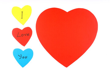 Valentines Day hearts on vintage White background as Valentines Day symbol. Heart shaped note papers with 