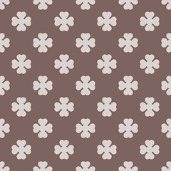 Fototapeta na wymiar Seamless decorative pattern on a brown background. Design for printing on textiles, wallpapers, background. The tiles can be combined with each other. 