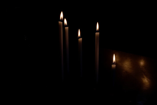 Flames of many burning candles
 - Powered by Adobe