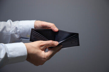 economic crisis. Business Person holding an empty wallet. Bankruptcy 