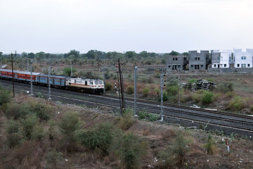 Indian railway train on paddy fields