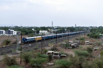 Indian Railway Blue train on Tracks - Passenger Train with Clear Sky.
