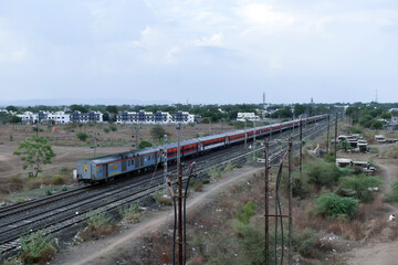 Fototapeta na wymiar view of Indian Railways trains on the track and nearby electric poles.