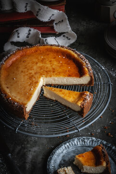 Delicious piece of delicious homemade cheesecake on plate with spoon