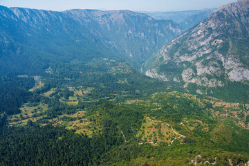 Naklejka na ściany i meble Top view of the canyon. Top view of the mountain river.