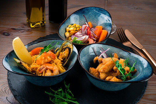 three-course set of salmon ceviche, seafood rice and fish chicharones