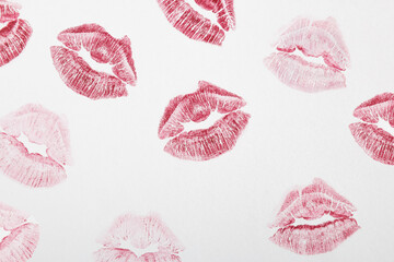 Red lipstick marks on a white background. Kiss symbol. Minimal love concept.Flat lay. - obrazy, fototapety, plakaty