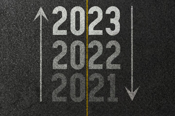 2021, 2022, 2023 on an asphalt road surface with marking lines. Concept of success in moving forward