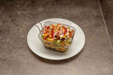 Crazy potatoes are a kind of fast food that consists of fries of any kind and is accompanied with mustard, chili, oregano