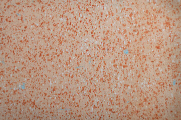 Beige texture with orange splashes. Background, wall