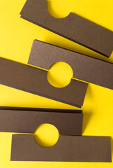 folded paper with semi circle cutout on bright yellow