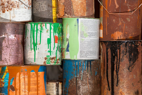 A Collection Of Paint Cans, Buckets, Toxic And Hazardous Material Stacked. Hazardous Waste.