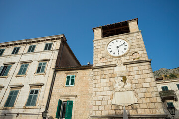 Fototapeta na wymiar Clock Tower inside the old town of Kotor