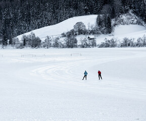 iceskater on frozen alpine lake Weissensee 