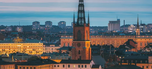 Foto op Aluminium Stockholm, Sweden. Scenic View Of Stockholm Skyline At Summer Evening. Famous Popular Destination Scenic Place In Dusk Lights. Riddarholm Church In Night Lighting. Close Up Stockholm, Sweden. Scenic © Grigory Bruev