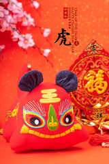 Tradition Chinese cloth doll tiger,2022 is year of the tiger,Chinese characters mean: "tiger".Rightside chinese wording and seal mean:Chinese calendar for the year.