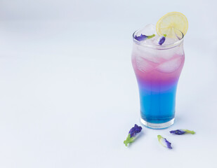 cocktail with ice and lime from butterfly pea flower (asian pigeonwings)
