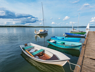 Boats by the pier on the lake.