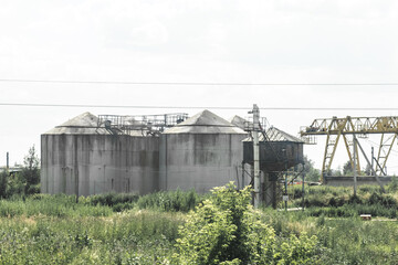 Abandoned fuel oil storage tanks at an industrial plant