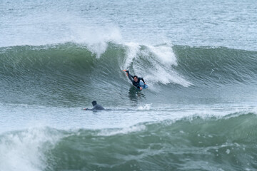 Bodyboarder surfing ocean wave