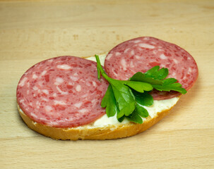 Sandwich with salami,  melted cheese and parsley. Homemade food. Food in a hurry.