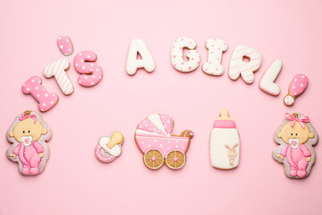 Phrase IT IS A GIRL and tasty cookies on pink background, flat lay. Baby shower party