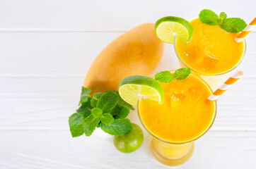 Mango fruit smoothies yogurt drink yellow healthy delicious taste in a glass slush for weight loss on white background.