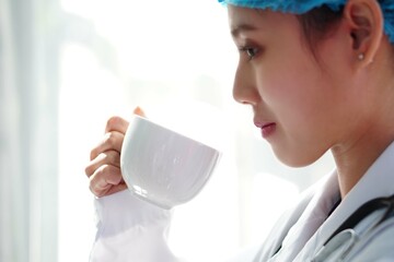 female doctor with coffee