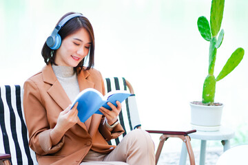 banner girl listening to music and read books