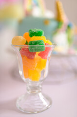 Birthday party treats, colorful jujubes on clear glass.