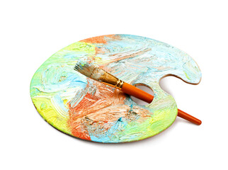 Artist's palette with mixed paints and brush isolated on white