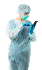 Laboratory Assistant, Doctor. A medic in protective medical clothing, in a disposable medical gown, mask, glasses, gloves, hat, holds a phone, dials a number, answers a call. portrait. isolated