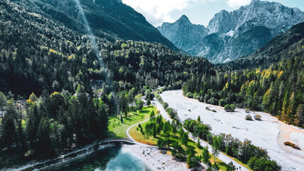 River Running Through Forested Mountain Valley © ANITEK MEDIA 