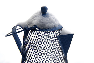 Metal pitcher in the snow