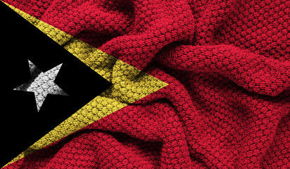 East Timor flag on knitted fabric. 3D-image
