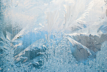 frost work winter background on window glass