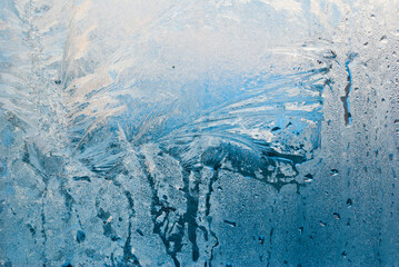 frost work winter background on window glass