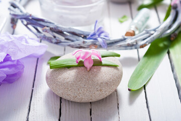 cosmetic cream product samples with hyacinth flowers on white wooden background
