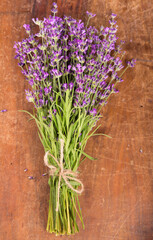 Fresh lavender over wooden background. Summer floral background with lavender flowers