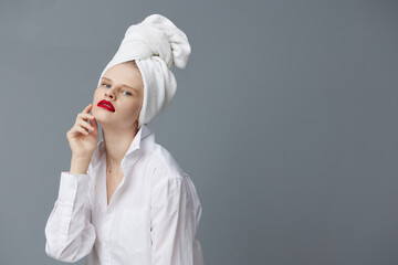 fashionable woman red lips towel on head makeup studio model unaltered