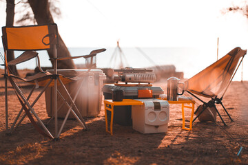 compact camping set for two in warm light, beach side park